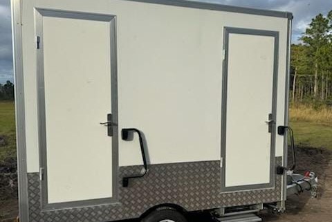 Luxury bathroom trailer rentals in Daytona Beach by Amelia Island Restroom Rentals. Elegant and convenient for events or construction. Call 904-816-3454 to reserve your trailer today!